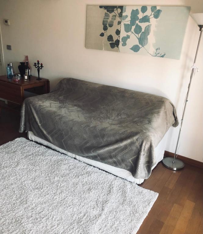 Postel nebo postele na pokoji v ubytování Stanza privata con bagno su appartamento condiviso