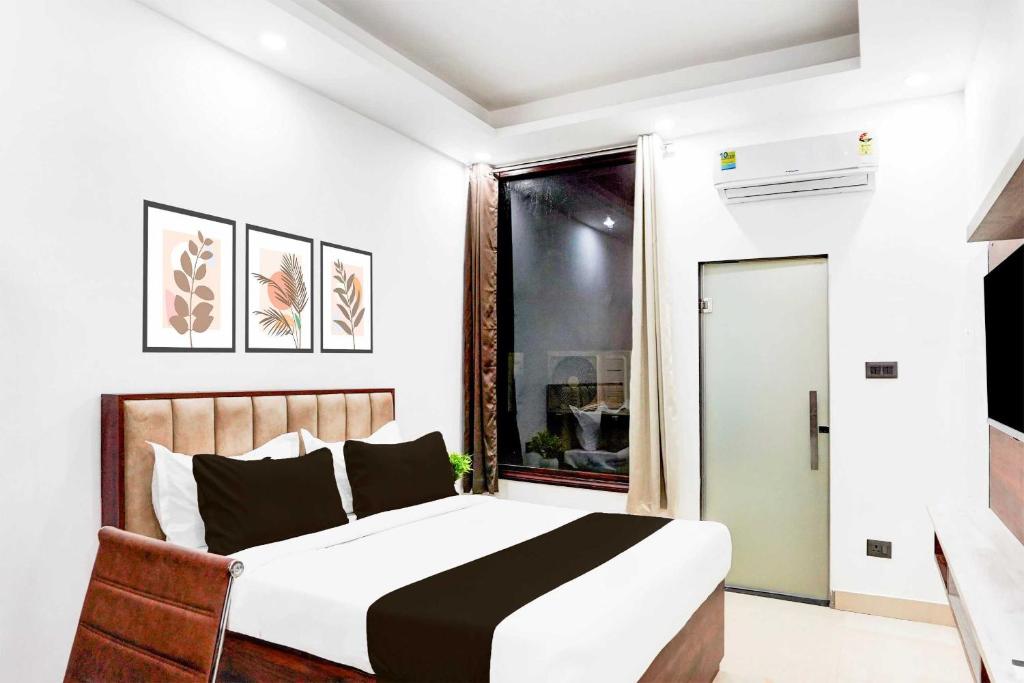 Postel nebo postele na pokoji v ubytování Hotel O Global