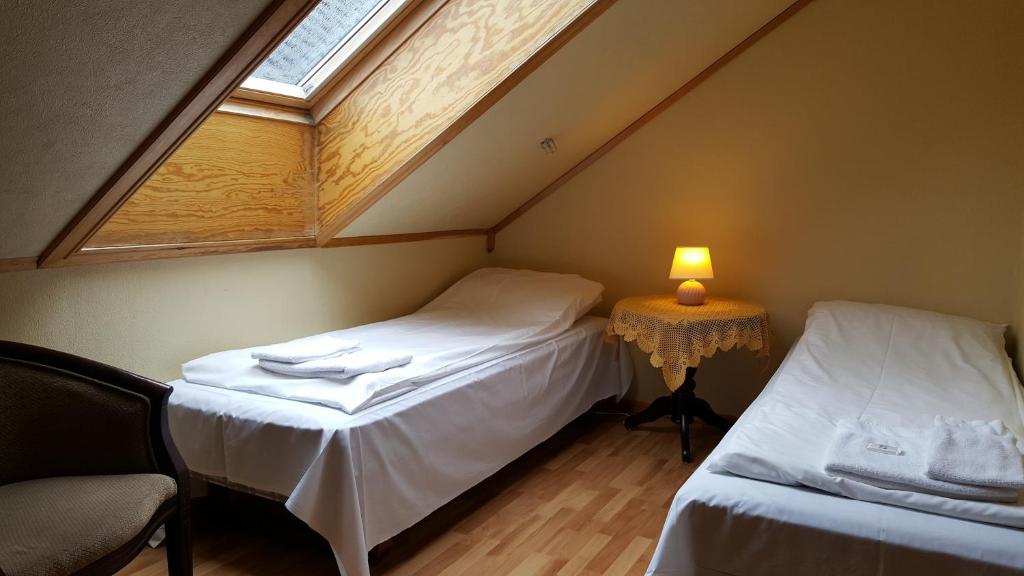 Postel nebo postele na pokoji v ubytování Skeisvang Gjestgiveri