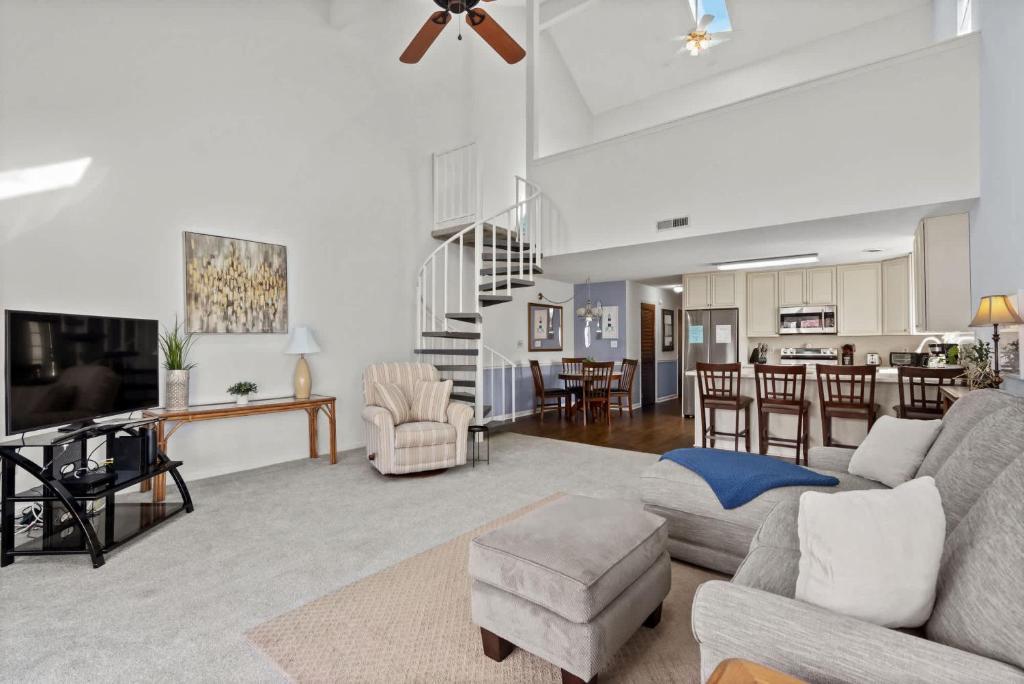 a living room with a couch and a table at 34j GCR-Ortiz Oasis in Myrtle Beach