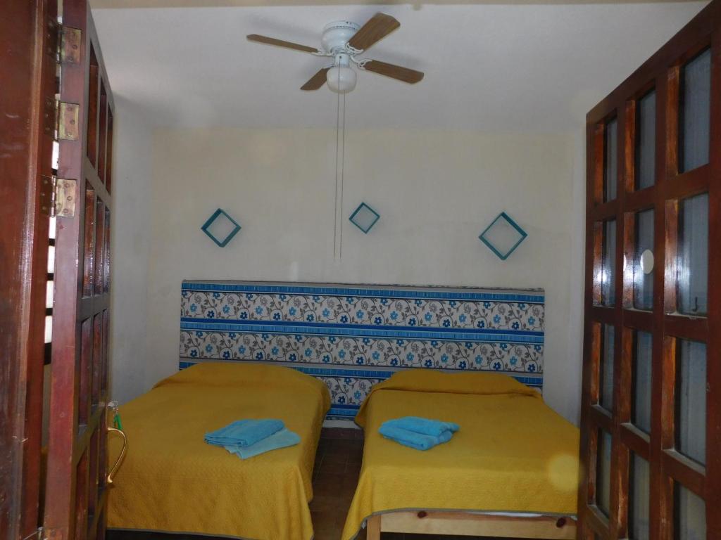 Postel nebo postele na pokoji v ubytování Casona Luciérnaga-Casa de Huéspedes