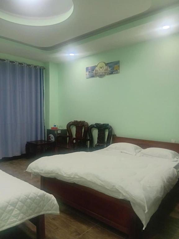 Postel nebo postele na pokoji v ubytování HOTEL MOTeL ĐỒNG KHỞI