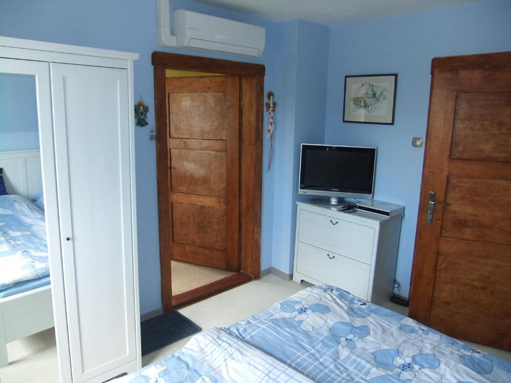 Postel nebo postele na pokoji v ubytování Słoneczne apartamenty