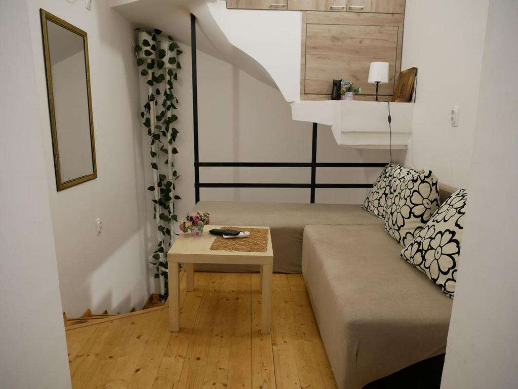 a living room with a couch and a table at Terazije apartment in Belgrade