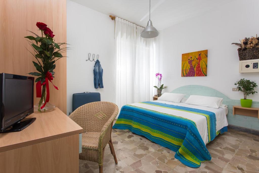 Postel nebo postele na pokoji v ubytování Hotel Gianlore