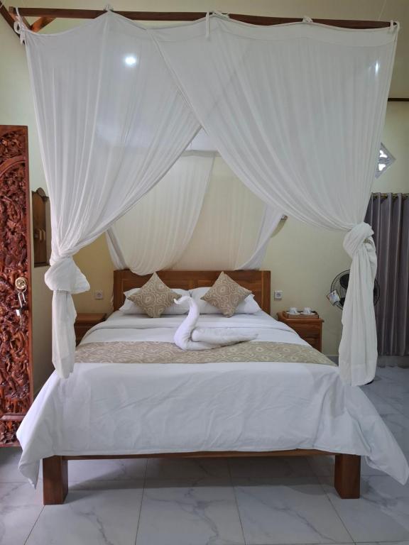 Ένα ή περισσότερα κρεβάτια σε δωμάτιο στο Kelle Homestay