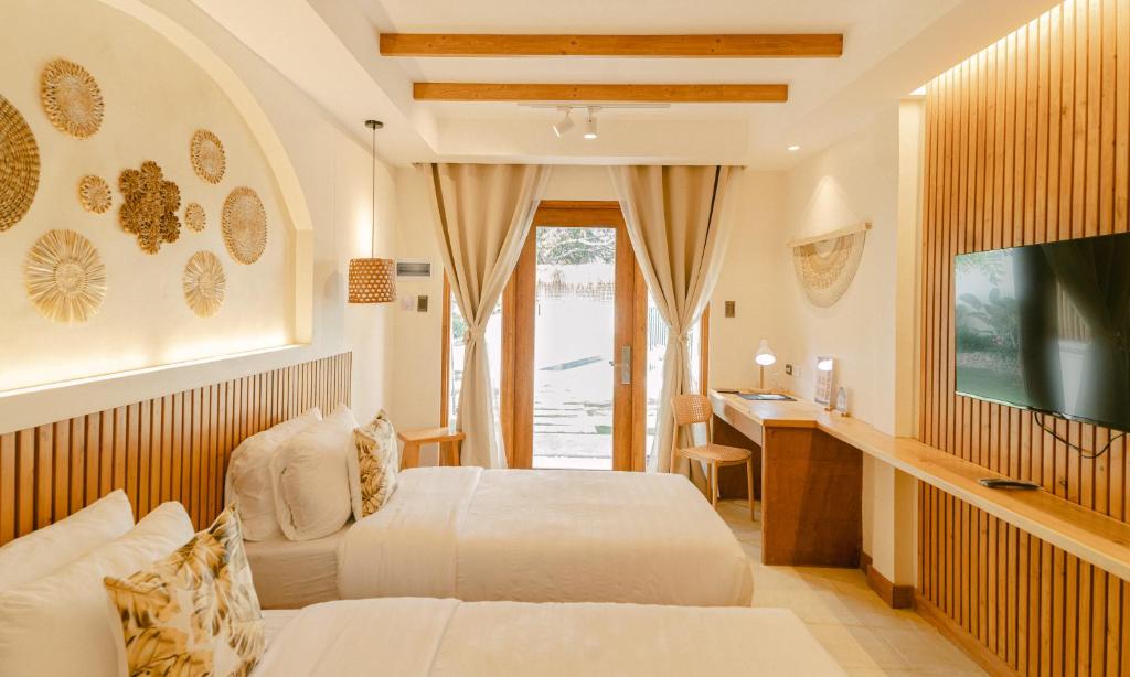 TV a/nebo společenská místnost v ubytování LEUX Hotel Alona Panglao