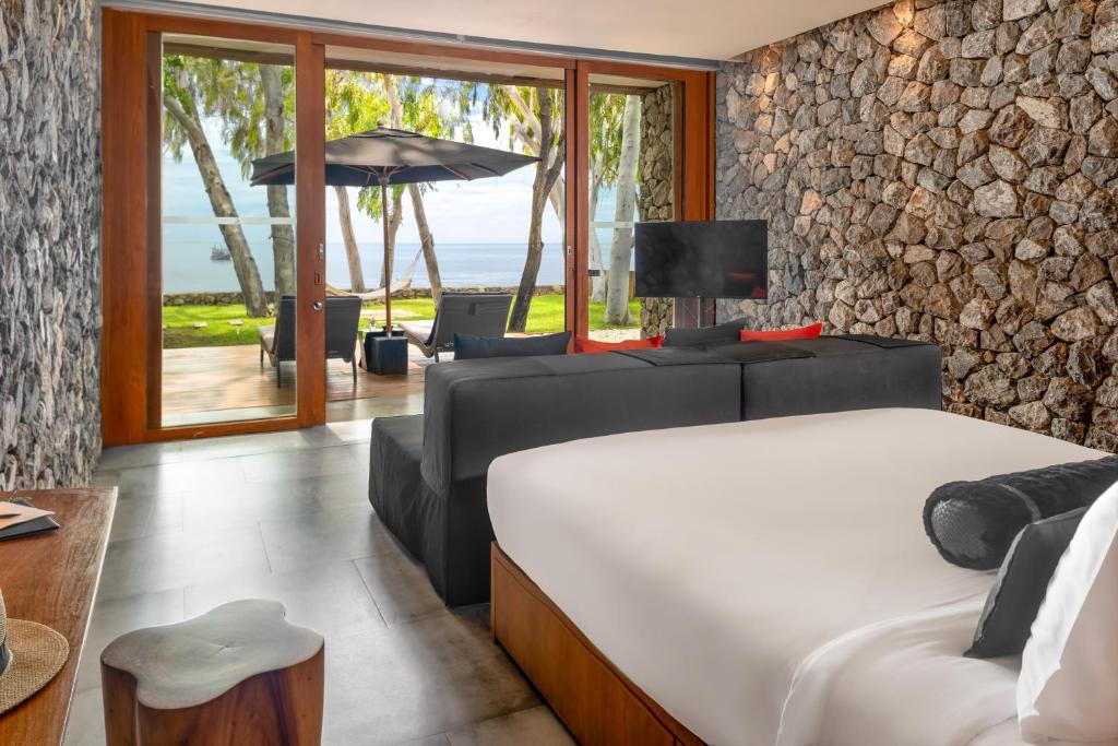 Postel nebo postele na pokoji v ubytování Tolani Resort Kui Buri