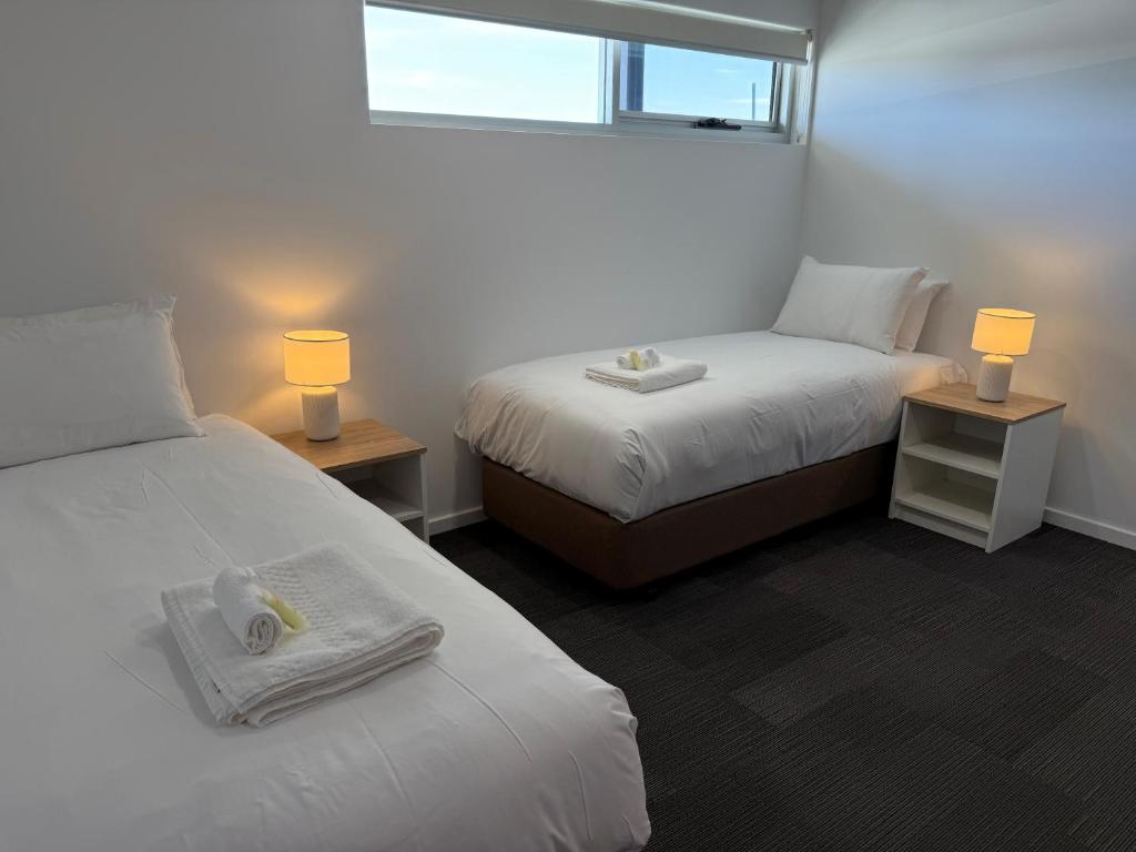 Postel nebo postele na pokoji v ubytování Brighton Hotel Motel