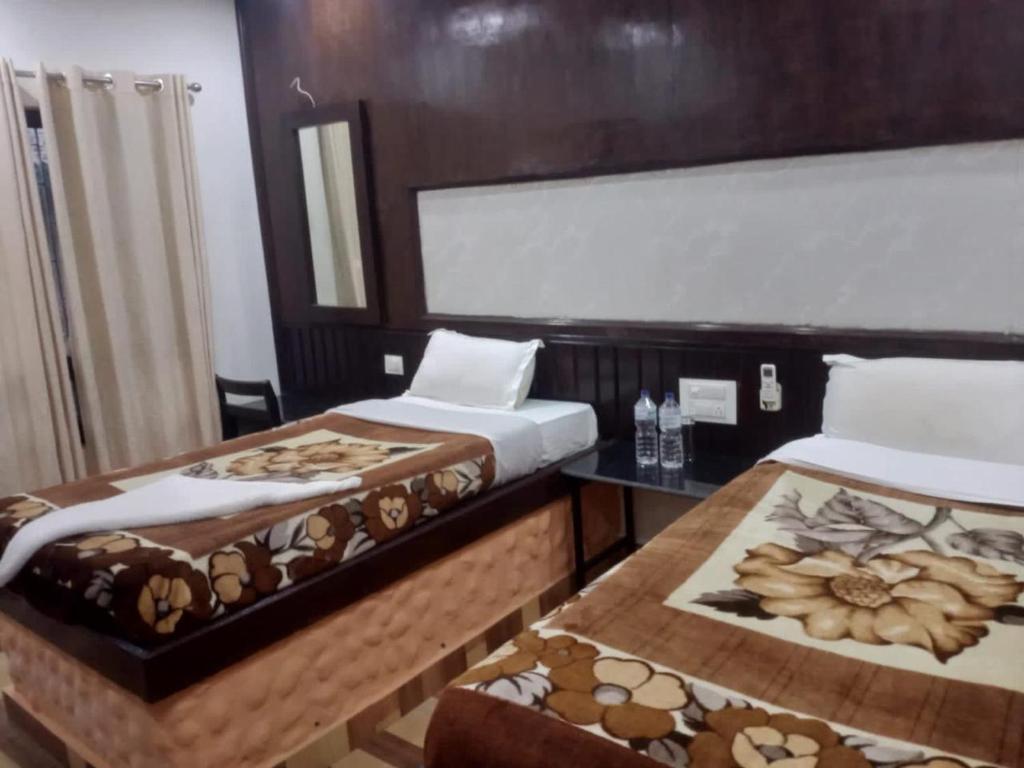 Postel nebo postele na pokoji v ubytování Siddhartha Kuti Resort