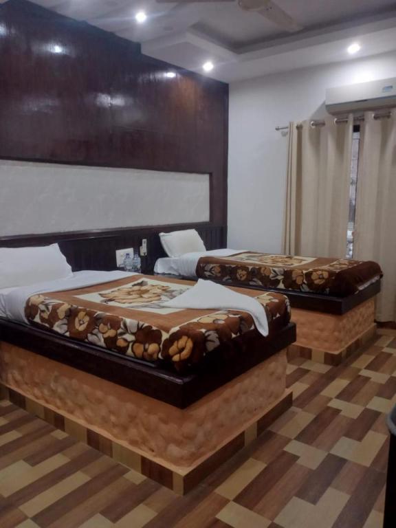 Postel nebo postele na pokoji v ubytování Siddhartha Kuti Resort