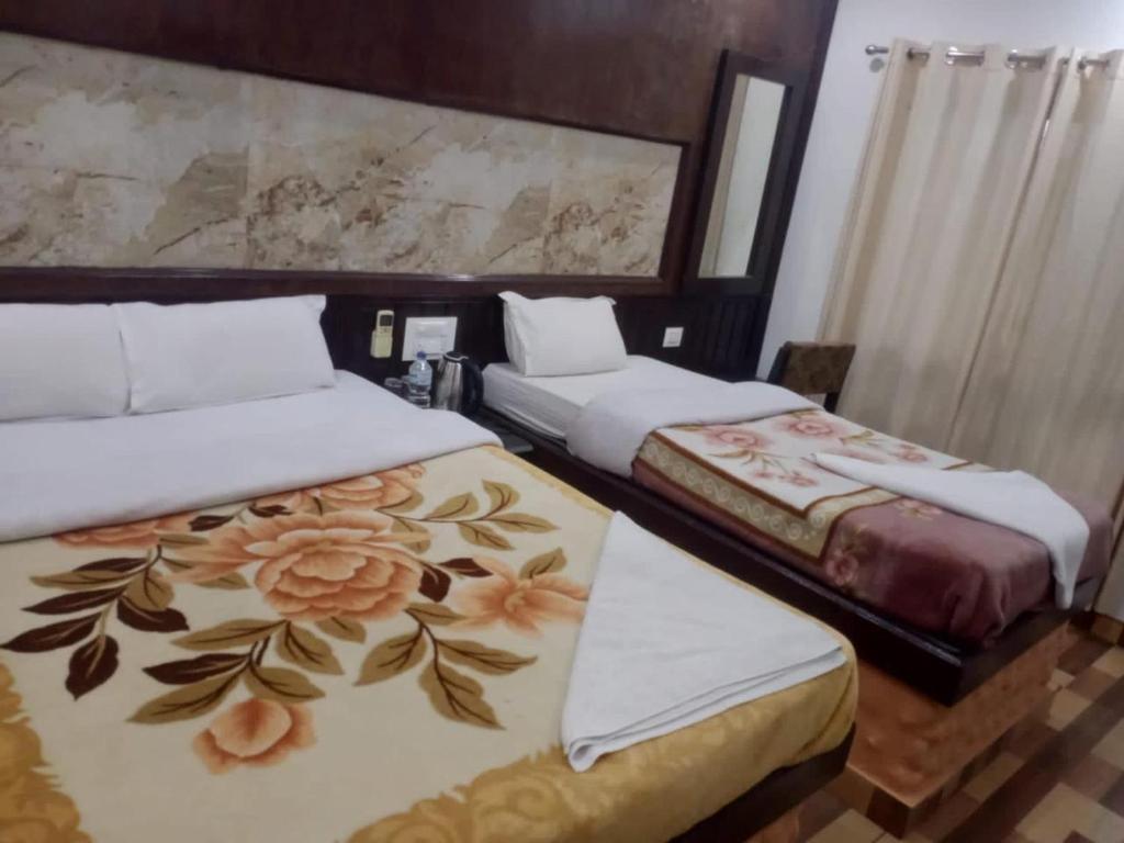 Postel nebo postele na pokoji v ubytování Siddhartha Kuti Resort