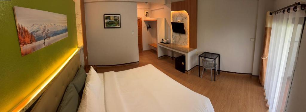 TV a/nebo společenská místnost v ubytování BanPunmanus Hotel