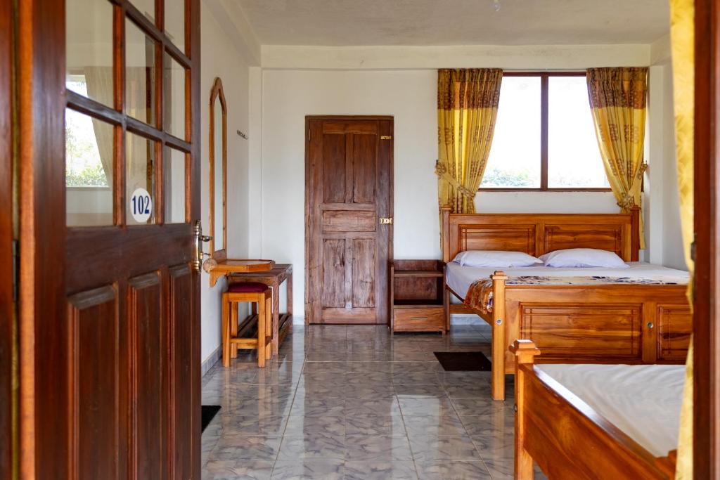 Postel nebo postele na pokoji v ubytování Ella Mountain Palace