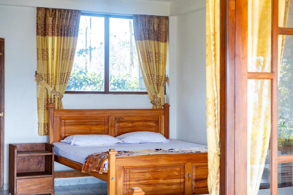 Postel nebo postele na pokoji v ubytování Ella Mountain Palace