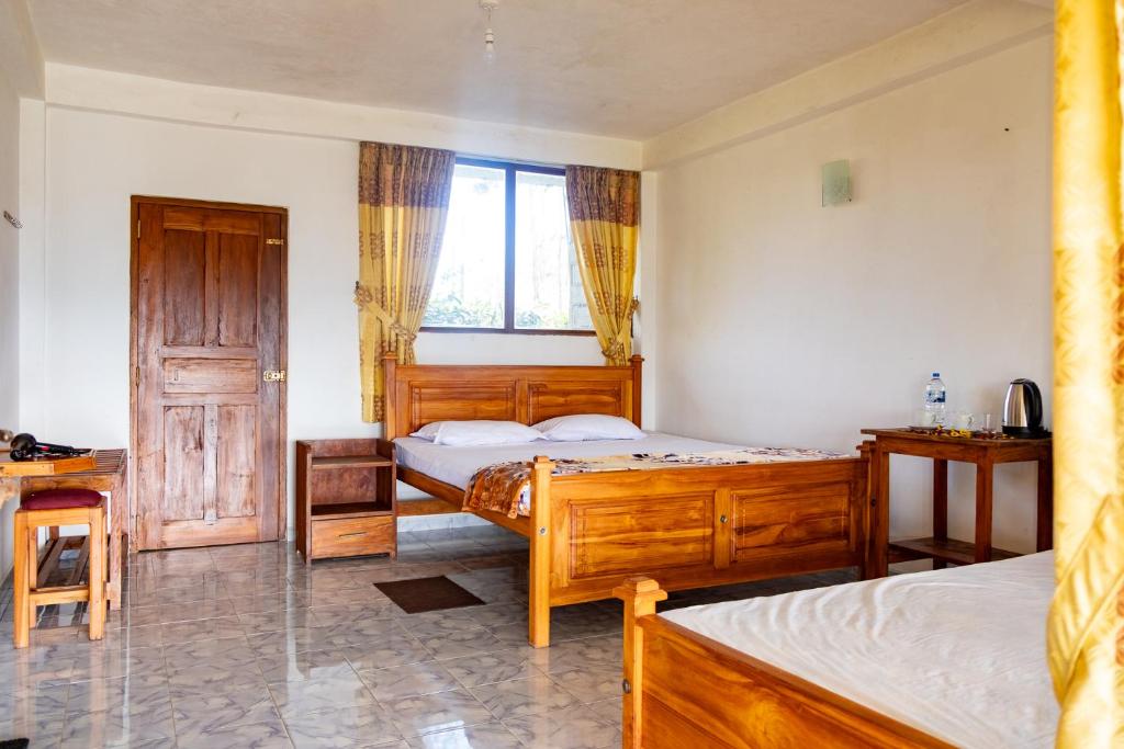 Postel nebo postele na pokoji v ubytování Ella Mountain Palace