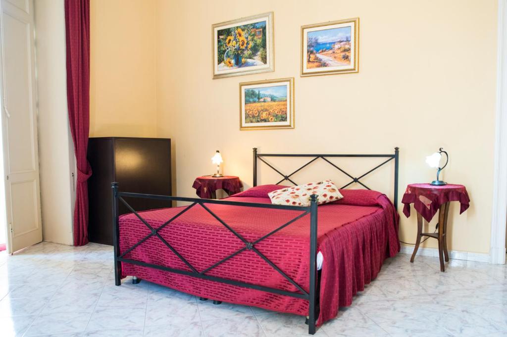 Postel nebo postele na pokoji v ubytování Sognando Ortigia