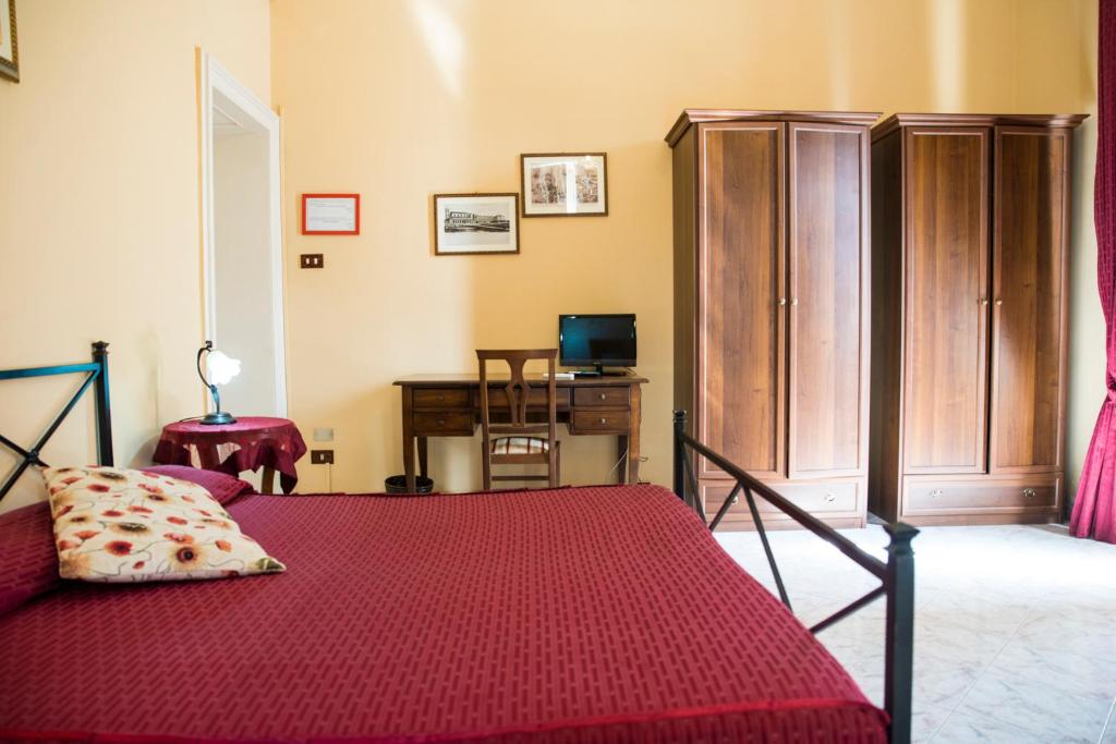Postel nebo postele na pokoji v ubytování Sognando Ortigia