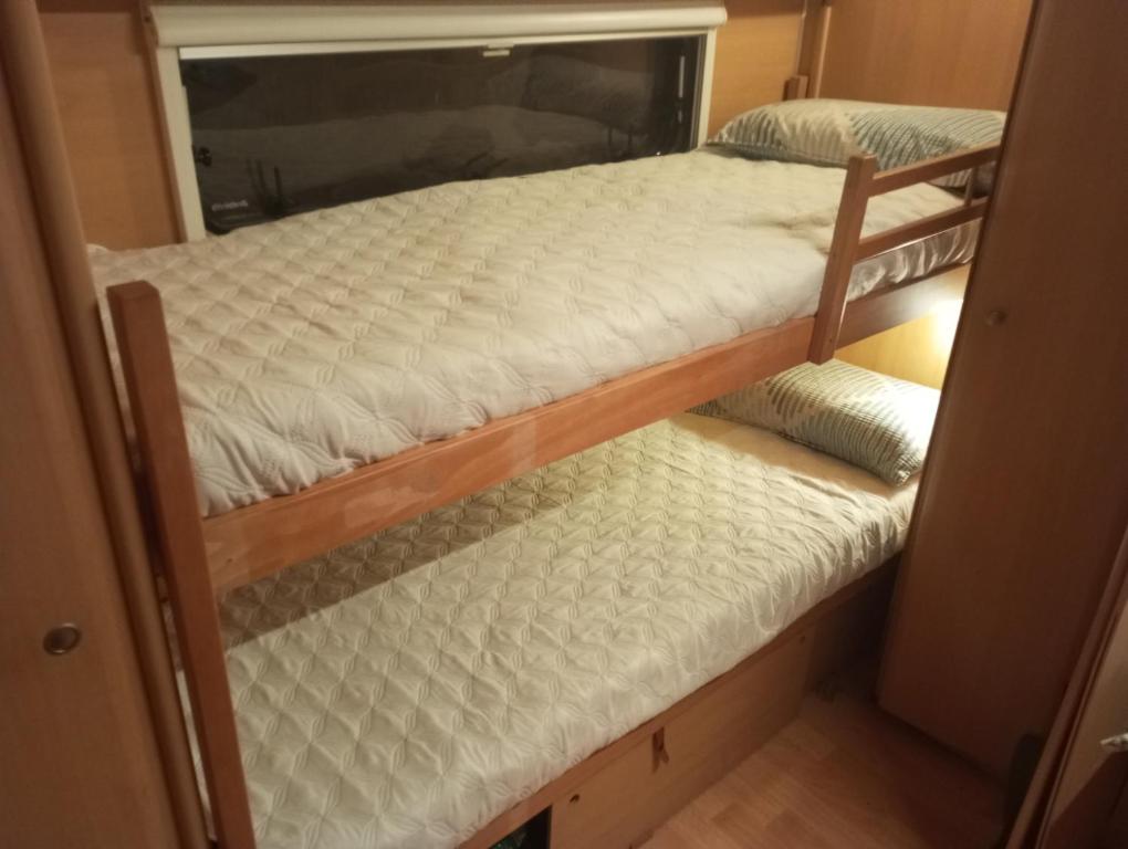 Postel nebo postele na pokoji v ubytování KairamSurf