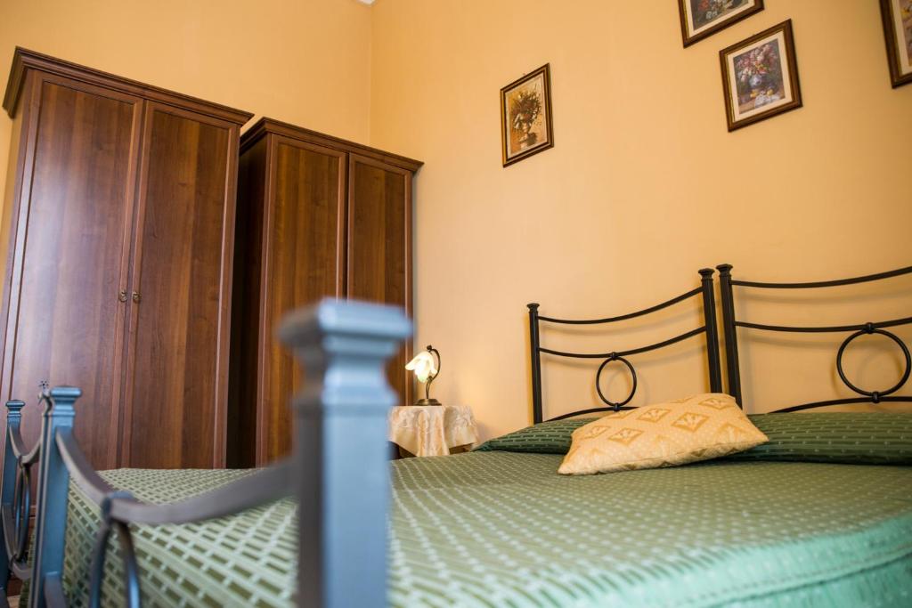 Postel nebo postele na pokoji v ubytování Sognando Ortigia
