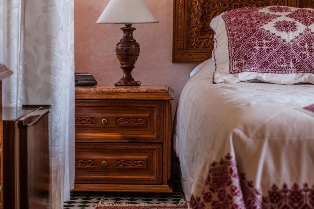 Letto o letti in una camera di Riad Alhambra