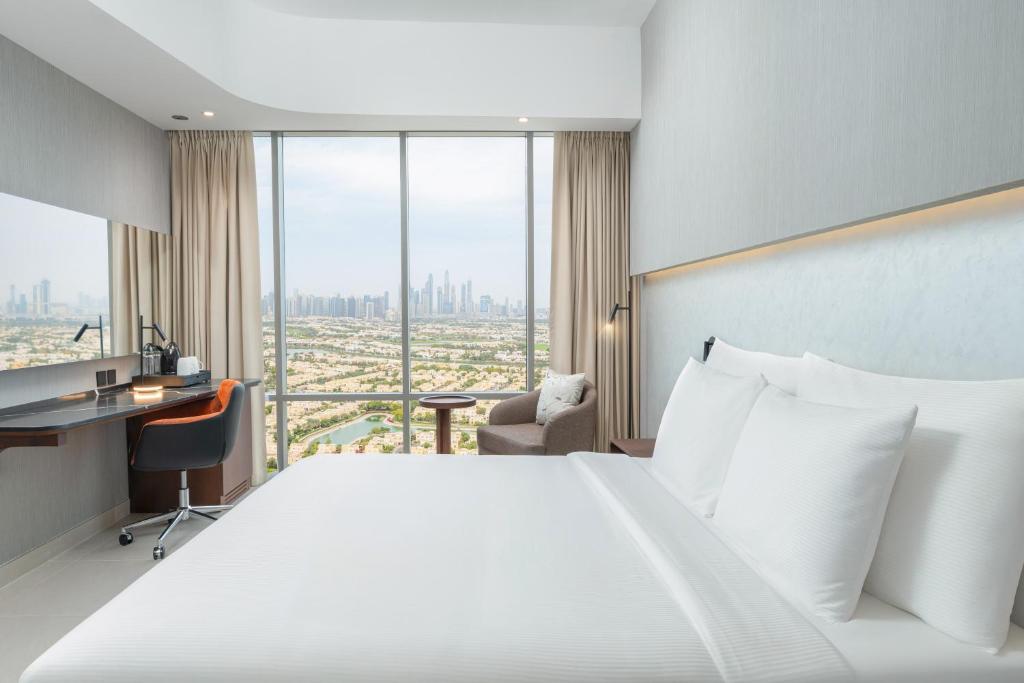 Postel nebo postele na pokoji v ubytování Hotel Local Dubai at Jumeirah Village Triangle