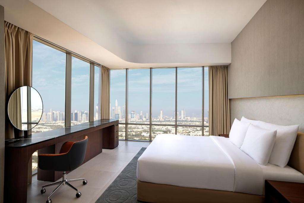 Postel nebo postele na pokoji v ubytování Hotel Local Dubai at Jumeirah Village Triangle