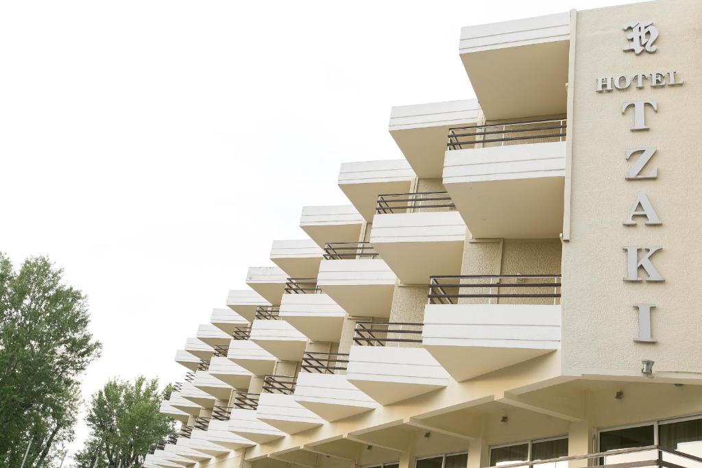 a building with balconies on the side of it at Tzaki hotel & restaurant Patras in Patra