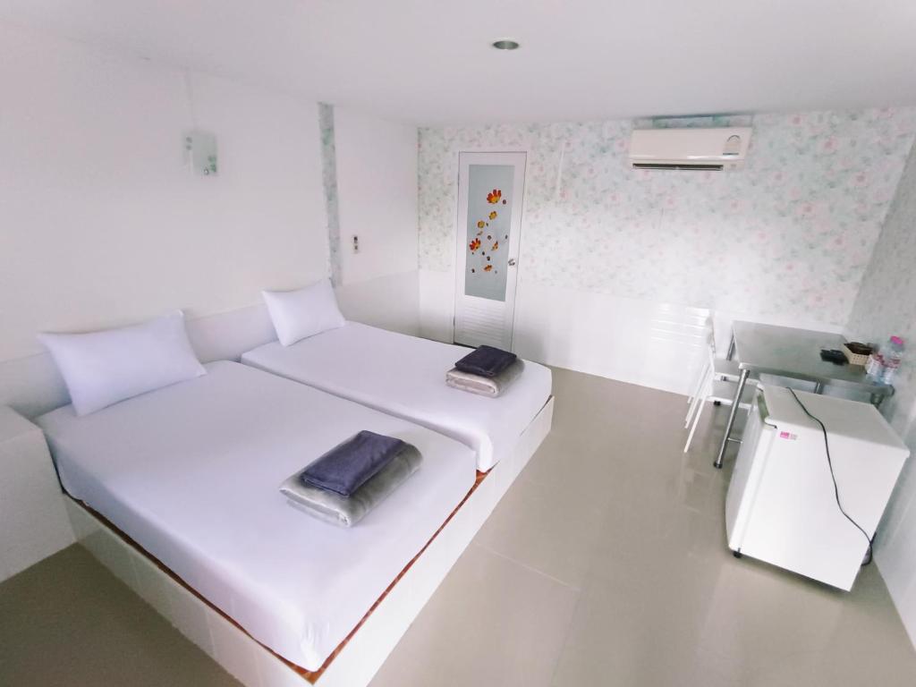 Postel nebo postele na pokoji v ubytování Saan Rak Resort