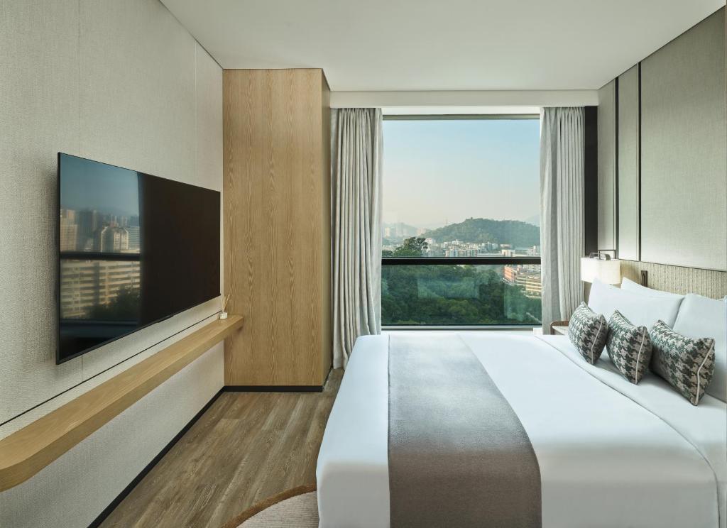 Postel nebo postele na pokoji v ubytování Grand Ocean View Hotel Zhuhai