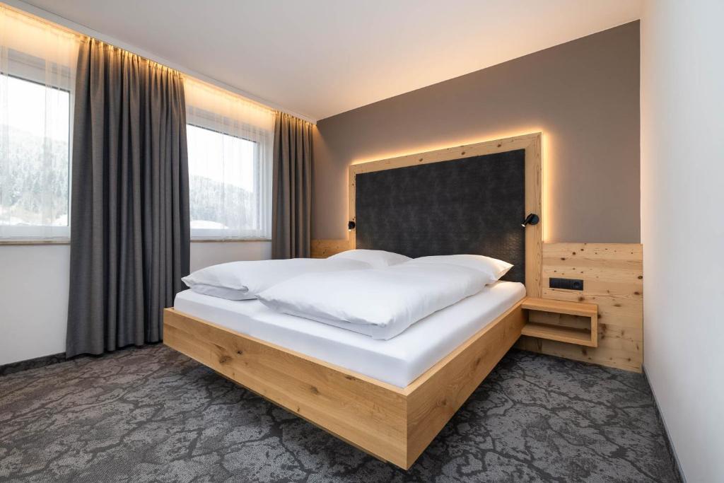 Postel nebo postele na pokoji v ubytování Hotel Forellenhof