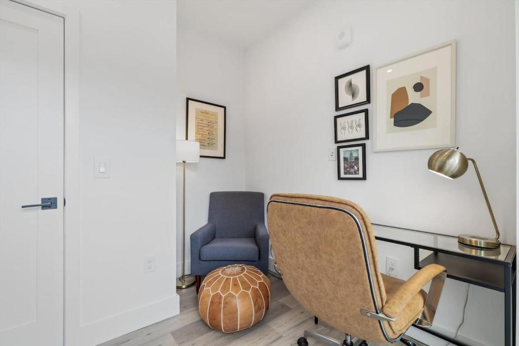 a office with a chair and a desk and a lamp at NoMa Convenience 2-BR Near Metro Union Market in Washington, D.C.