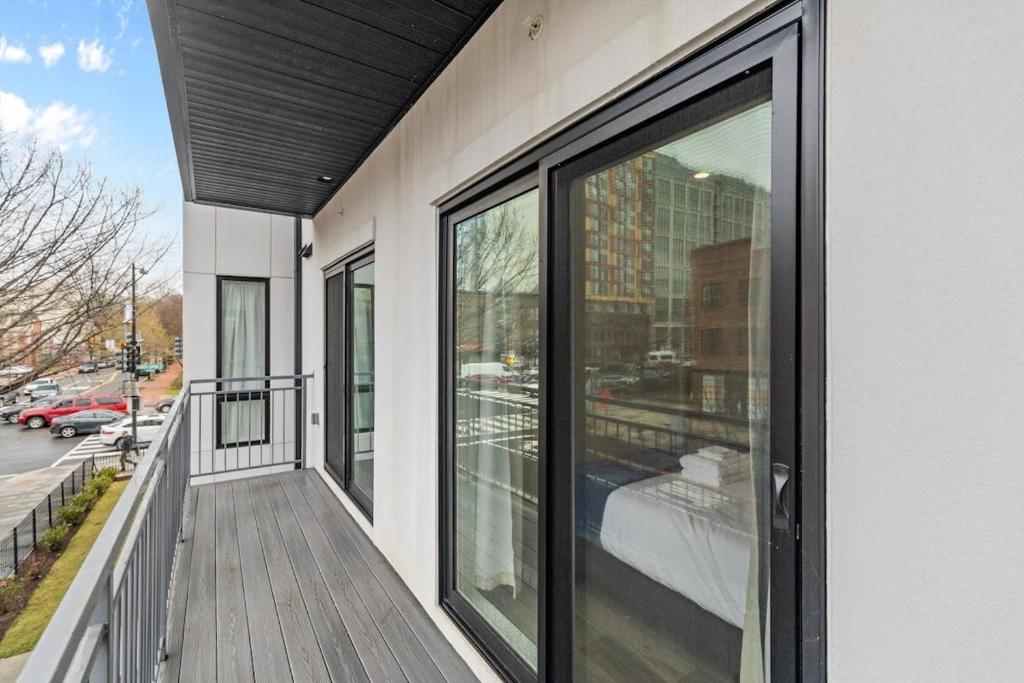 a balcony with sliding glass doors on a building at NoMa Convenience 2-BR Near Metro Union Market in Washington, D.C.