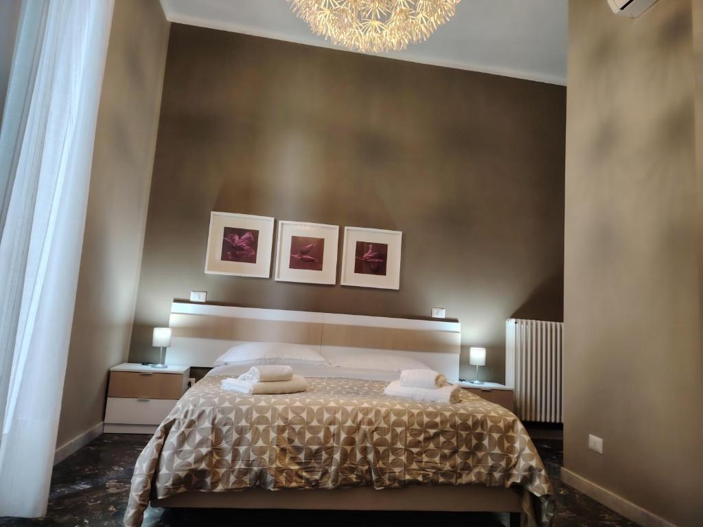 Łóżko lub łóżka w pokoju w obiekcie B&B Lucana 22