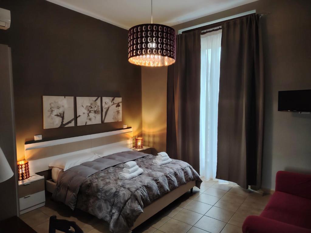 Łóżko lub łóżka w pokoju w obiekcie B&B Lucana 22