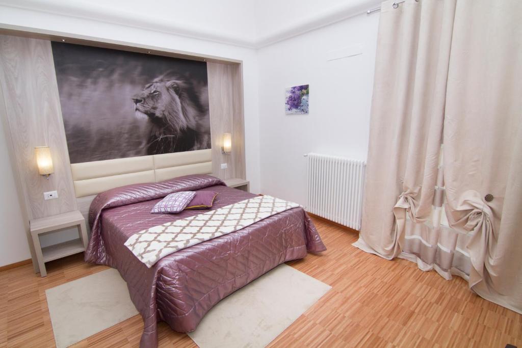 Кровать или кровати в номере Al Bastione Relais Suite & Rooms