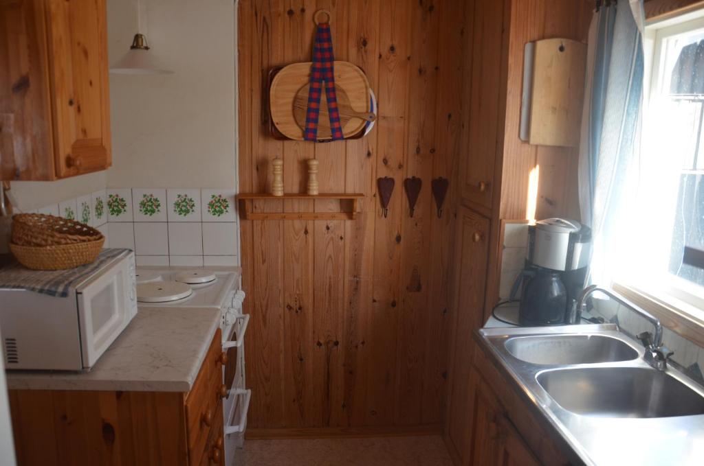 Kuchyň nebo kuchyňský kout v ubytování Grinderum