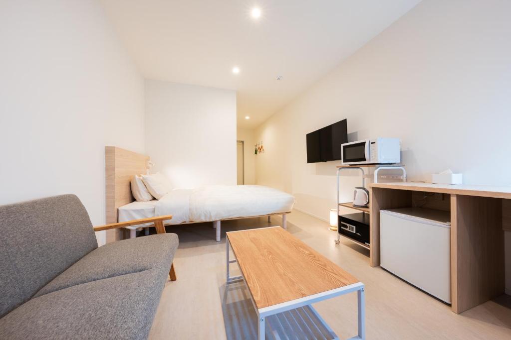 TV a/nebo společenská místnost v ubytování Hotel Meguri