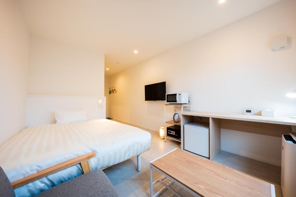 TV a/nebo společenská místnost v ubytování Hotel Meguri