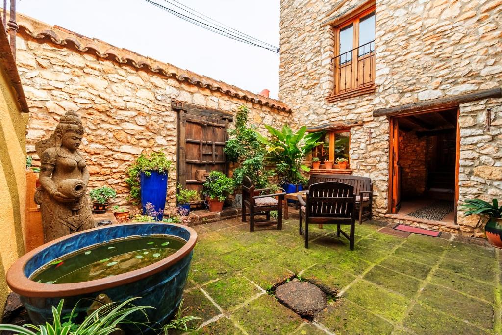 Patio alebo iná vonkajšia časť ubytovania Ca la petita den chinascas