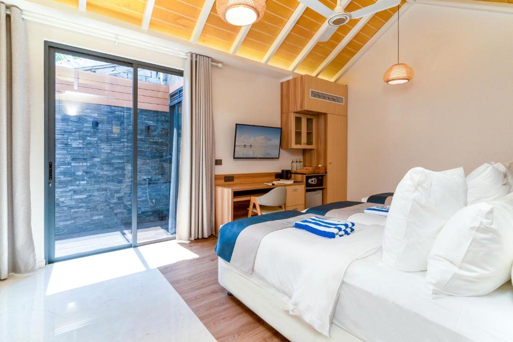 Postel nebo postele na pokoji v ubytování ARIA Beach, Ukulhas