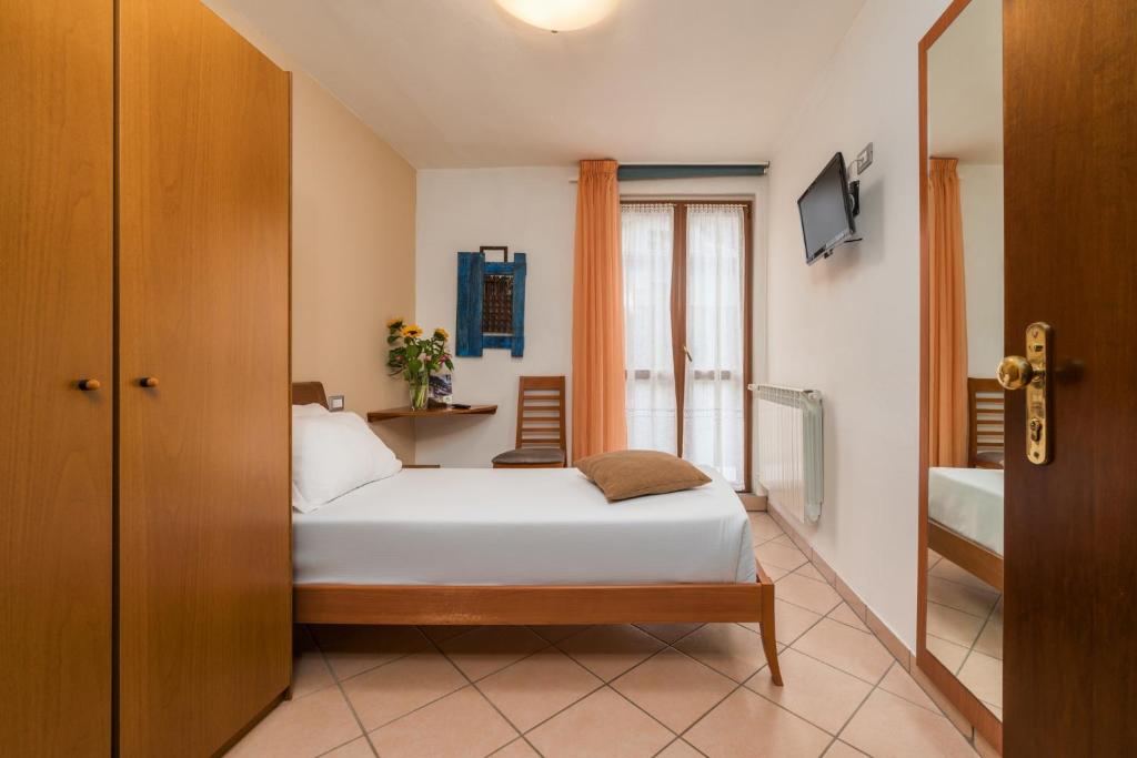 Postel nebo postele na pokoji v ubytování Hotel Oasi Verde