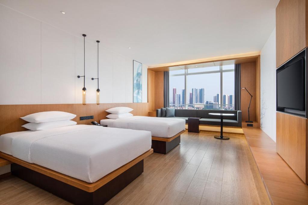 Postel nebo postele na pokoji v ubytování Fairfield by Marriott Foshan Nanhai