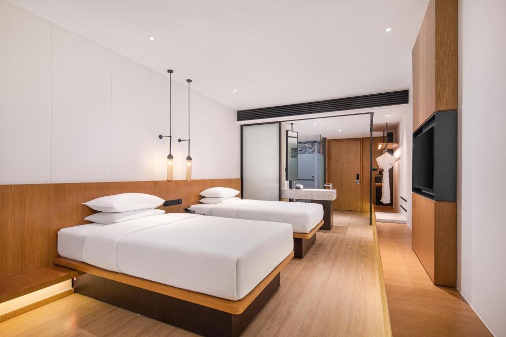 Postel nebo postele na pokoji v ubytování Fairfield by Marriott Foshan Nanhai