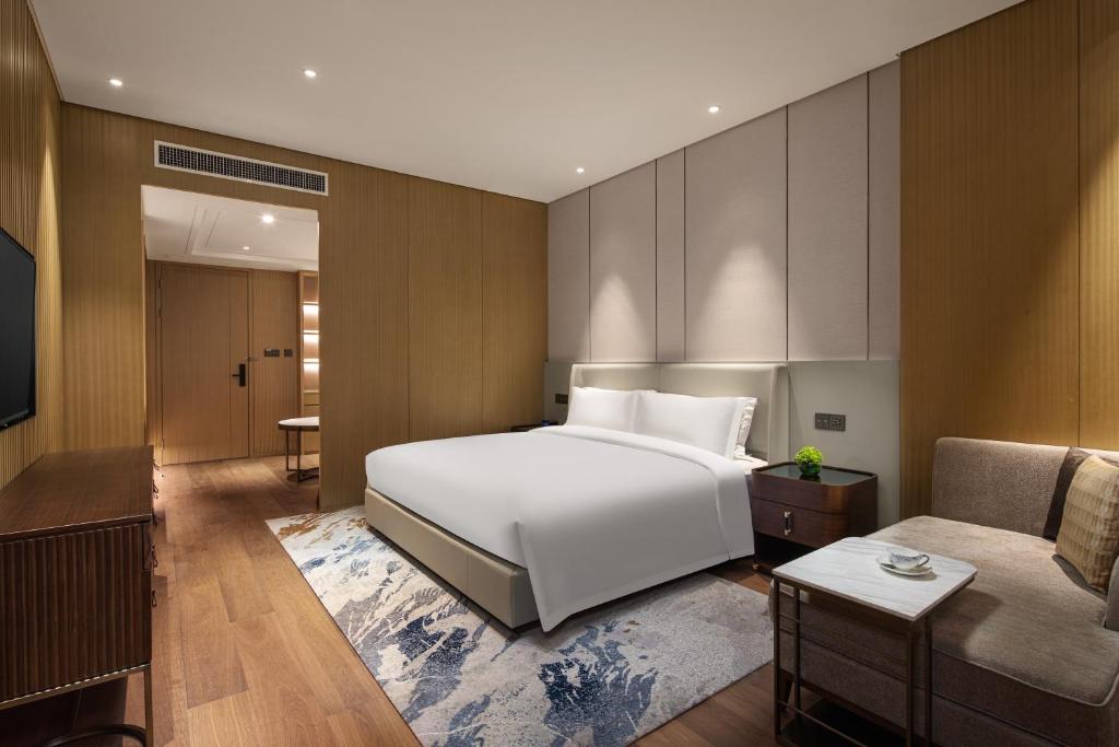 Postel nebo postele na pokoji v ubytování Wyndham Shanghai Pudong