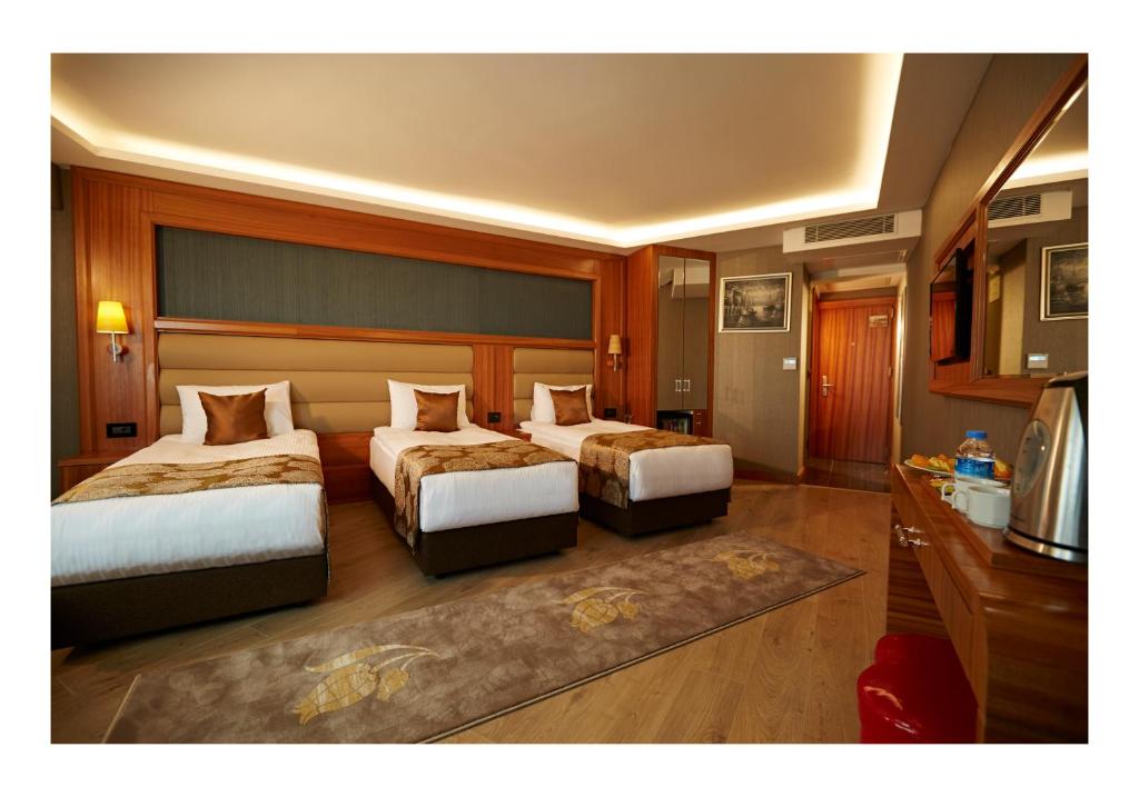 Postel nebo postele na pokoji v ubytování Ilkbal Deluxe Hotel &Spa Istanbul
