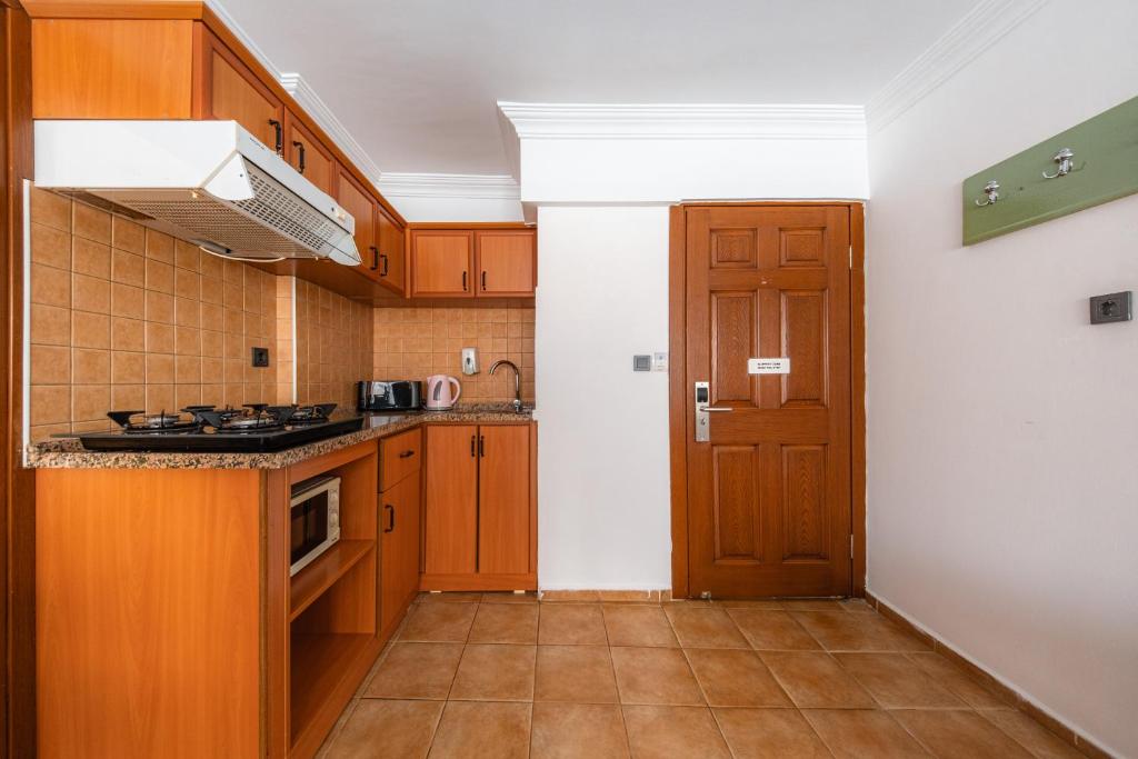 Kuchyň nebo kuchyňský kout v ubytování Ten Apart Hotel