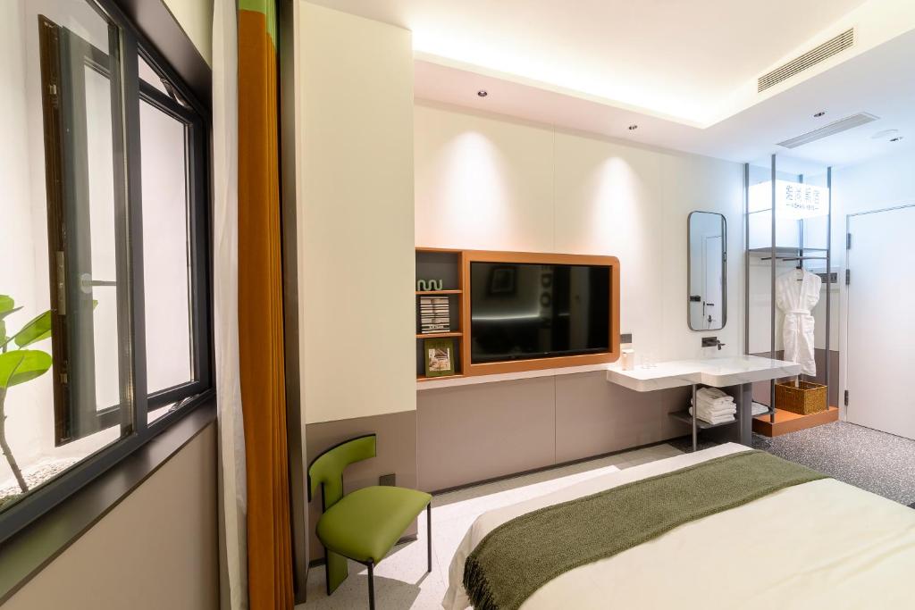 Postel nebo postele na pokoji v ubytování Vishan Keys Hotel 维尚潮宿