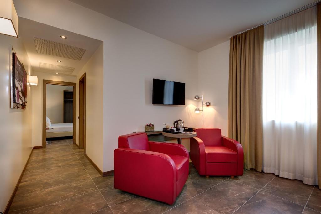 TV a/nebo společenská místnost v ubytování Klima Hotel Milano Fiere