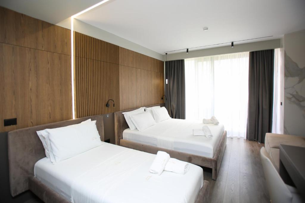 Postel nebo postele na pokoji v ubytování Charm Hotel